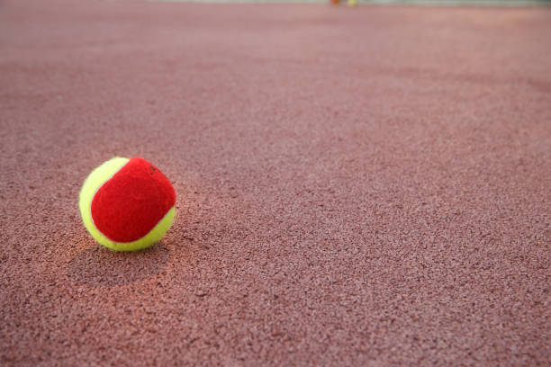 Rénovation terrain de tennis en béton poreux paris